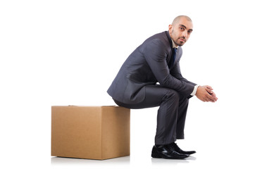 Businessman with box isolated on the white