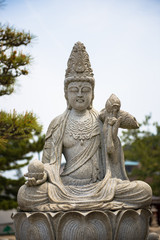 Seated Buddha statue at temple in Tokyo, Japan