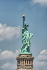 Fototapeta na wymiar The Statue of Liberty in New York City. Front view on a beautifu