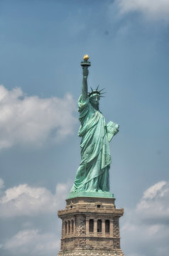 The Statue of Liberty in New York City. Front view on a beautifu