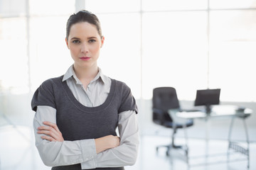 Stern businesswoman posing