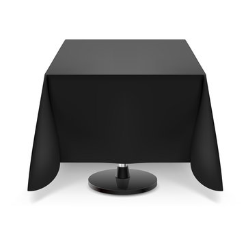 Square table with black tablecloth.