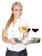 Pretty lady waitress with four glasses of wine