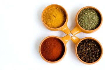 The combination of the four cups with spices