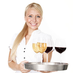 Smiling waitress serves wine glasses