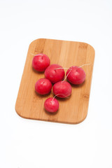 Garden radish on wooden board