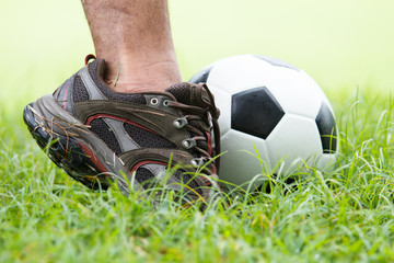 soccer ball with his feet