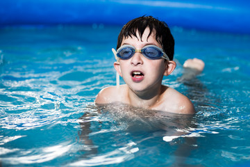 boy swimming in the pool