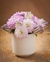 Beautiful aster flower bouquet on wooden table