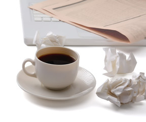 Coffee cup and newspaper