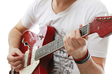 Fototapeta premium Rocker with his classic acoustic guitar against white background