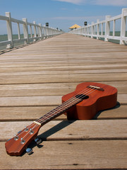 ukulele on wooden floor