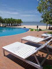 chairs around swimming pool