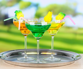 Different cocktails on bright background