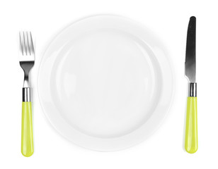 Knife, color plate and fork, isolated on white
