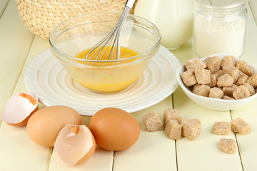 Ingredients for dough on wooden table close-up