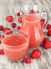 Delicious strawberry juice on table close-up