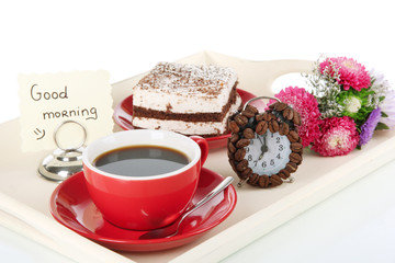 Cup of tea with cakes on wooden tray isolated on white