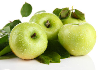 Juicy green apples with leaves, isolated on white