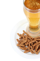 Beer in glass and croutons isolated on white