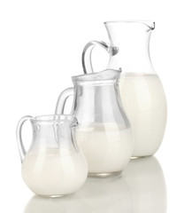 Milk in jugs isolated on white
