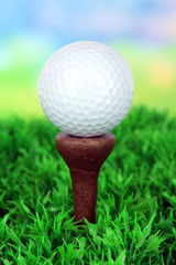 Golf ball  on green grass outdoor close up