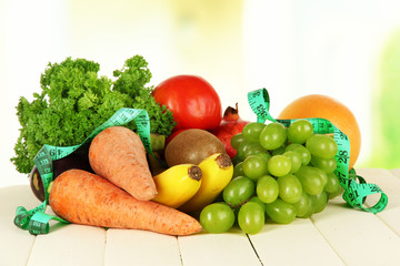 Fresh vegetables on table on light background