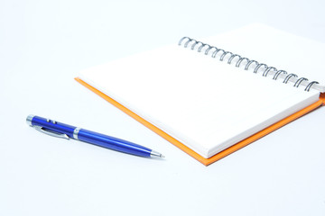 notebook and pen on white