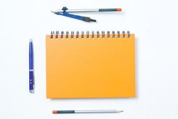 dividers, notebook, pen and pencil on white