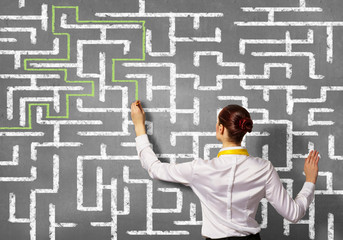 Businesswoman solving maze problem