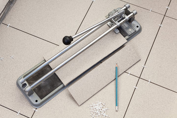 Fototapeta na wymiar Tile cutter for floor repair