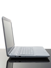 Laptop on black desk