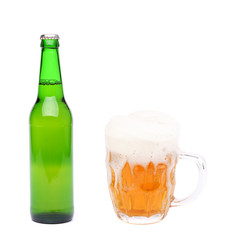 Closed bottle and mug of beer with froth.