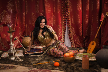 Beautiful arabic woman with hookah