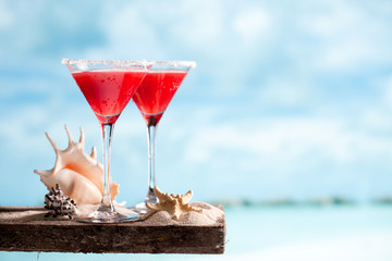 red drink on beach