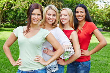 Group of four happy women in nature
