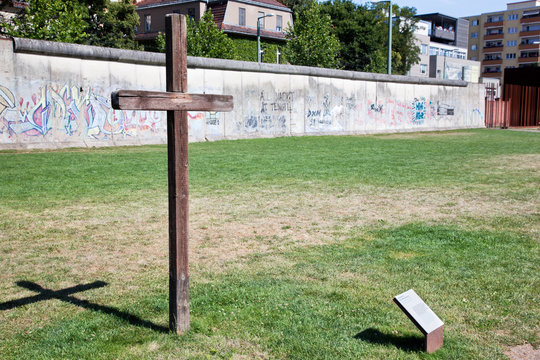 Berlin Wall Memorial with graffiti and cross