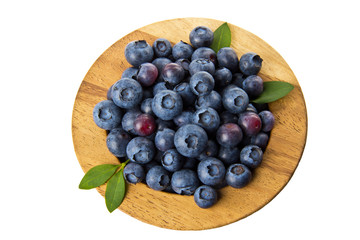 Wooden bowl with blueberries