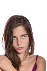 Fototapeta premium portrait of a teenage girl looking upwards isolated on white