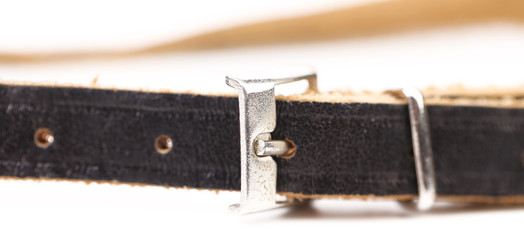Black leather belt with a rectangular buckle