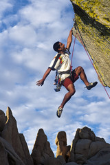 Dangling from the edge.
