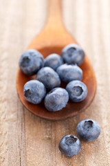 Blueberries in wooden scoop