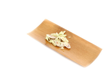 Fresh Lemon Grass and Slice it in black dish on white background