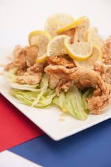 Deep fried chicken with honey and lemon sauce.