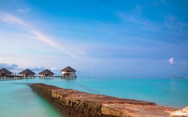 Over water bungalows with steps into amazing green lagoon