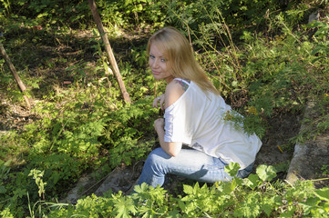 Beautiful woman in summer forest