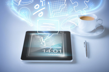 tablet pc with icons and coffee