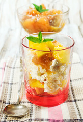 cottage cheese dessert with peaches in a glass