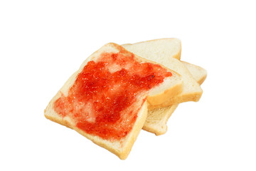 Strawberry jam spread on bread on isolated white background