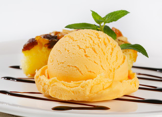 Ice cream and piece of sponge cake